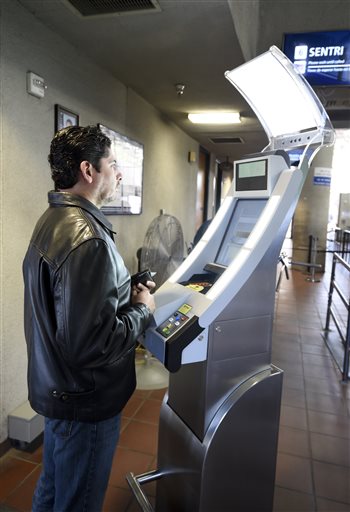 Automated scanner reading Border Crossing Card at the Tijuana