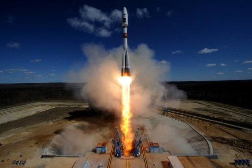 Rocket launch from cosmodrome. Fight of space rocket in blue sky