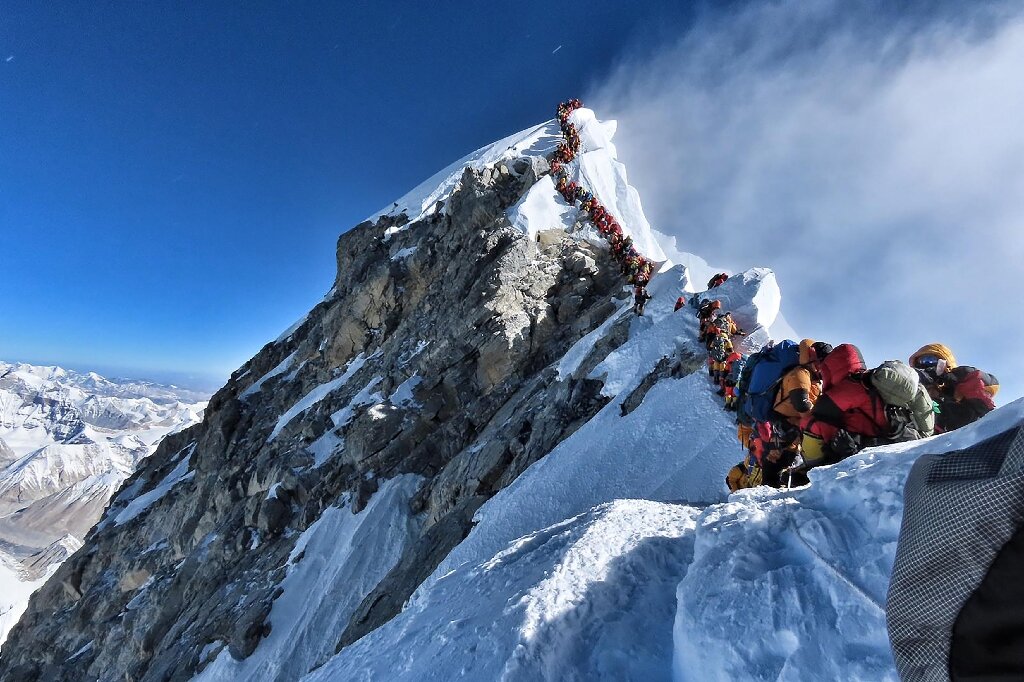 Traffic jam' on Everest as two more climbers die reaching summit
