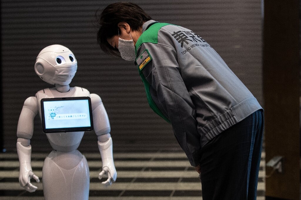 I'm cheering for you': Robot welcome at Tokyo quarantine