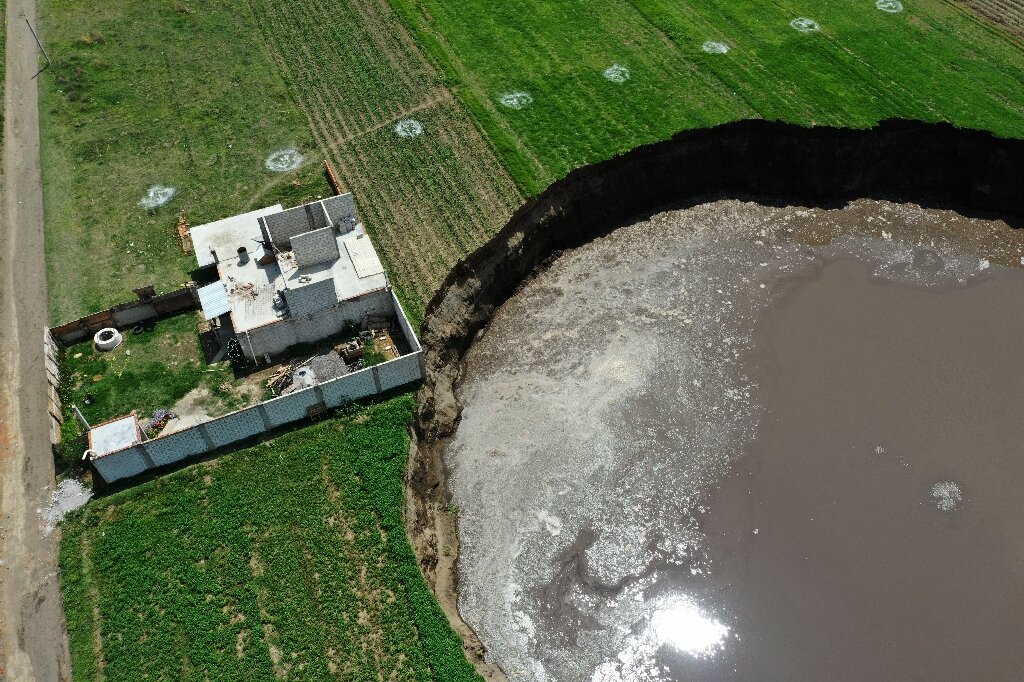 Huge Sinkhole Threatens To Swallow Mexican Home