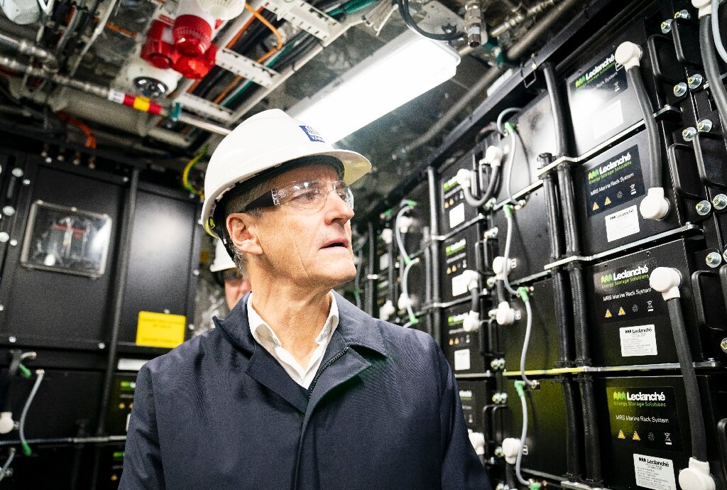 Norway's Prime Minister Jonas Gahr Store takes a tour of the Birkeland's power array—equivalent to 100 Teslas