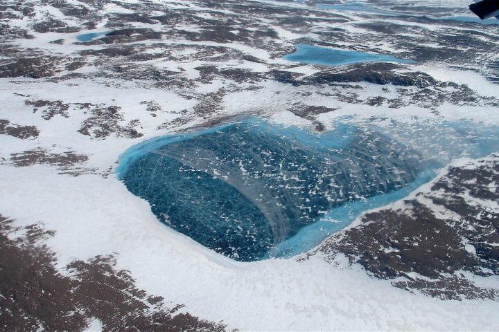 Ice sheet surface melt is accelerating in Greenland and slowing in Antarctica, finds study
