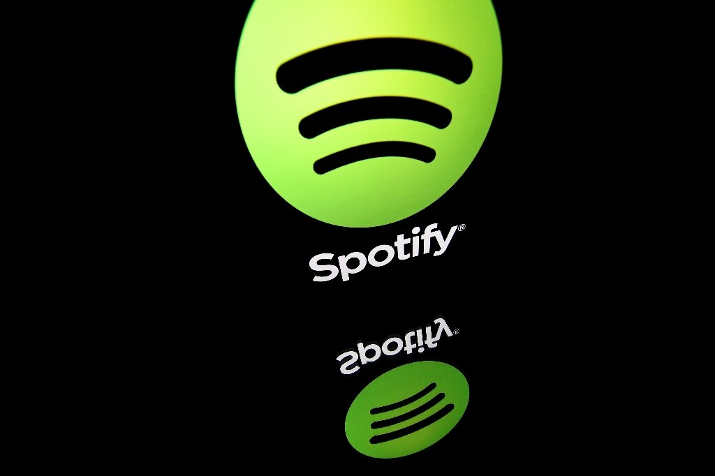 Spotify reports strong user growth, raises prices