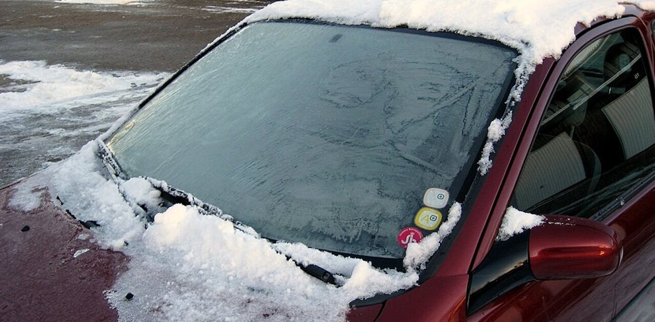 Liquid Spray for Car Window Defrost in Winter Season. Stock Photo