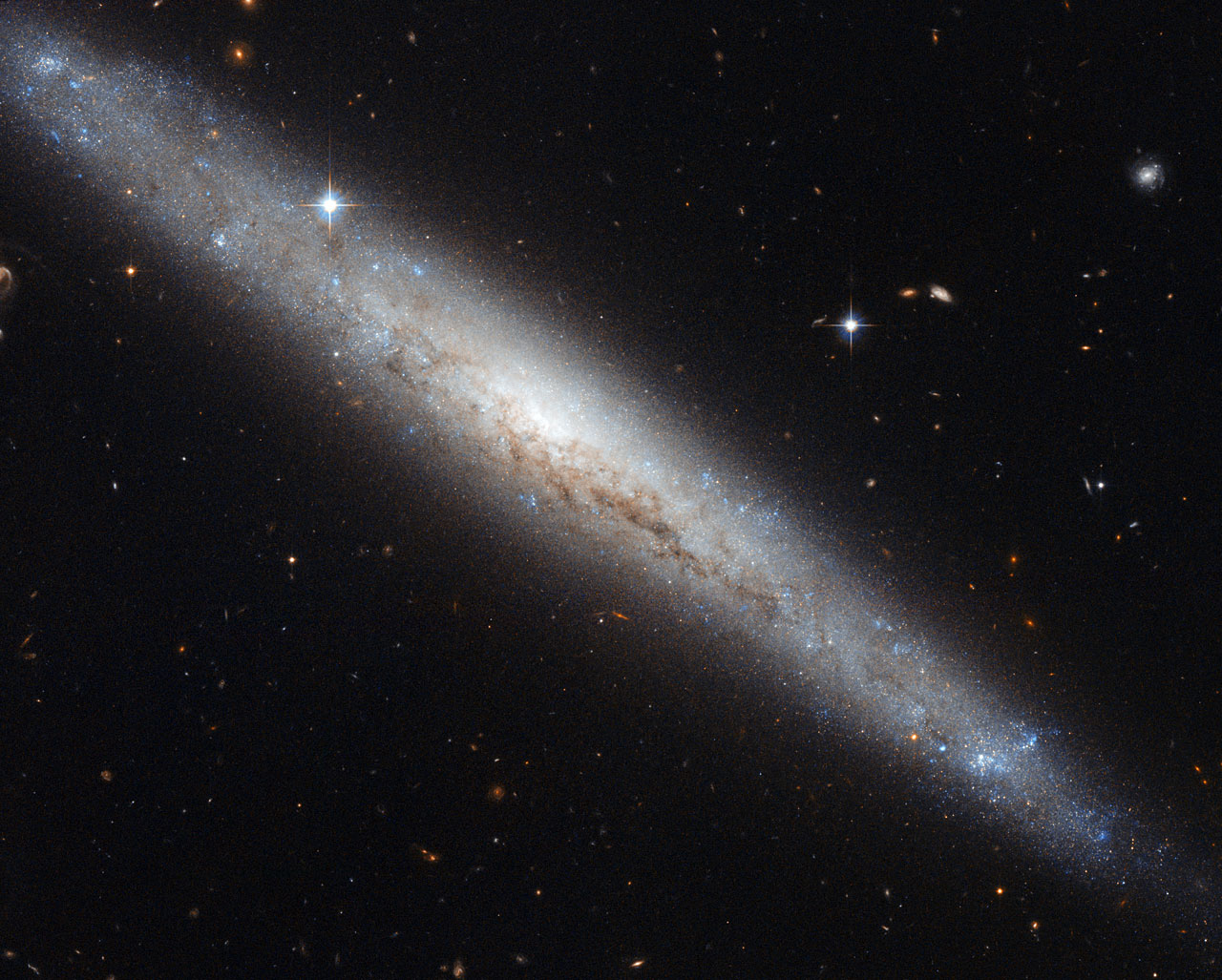 55 million light years from the Sun: Hubble portrays dusty spiral galaxy