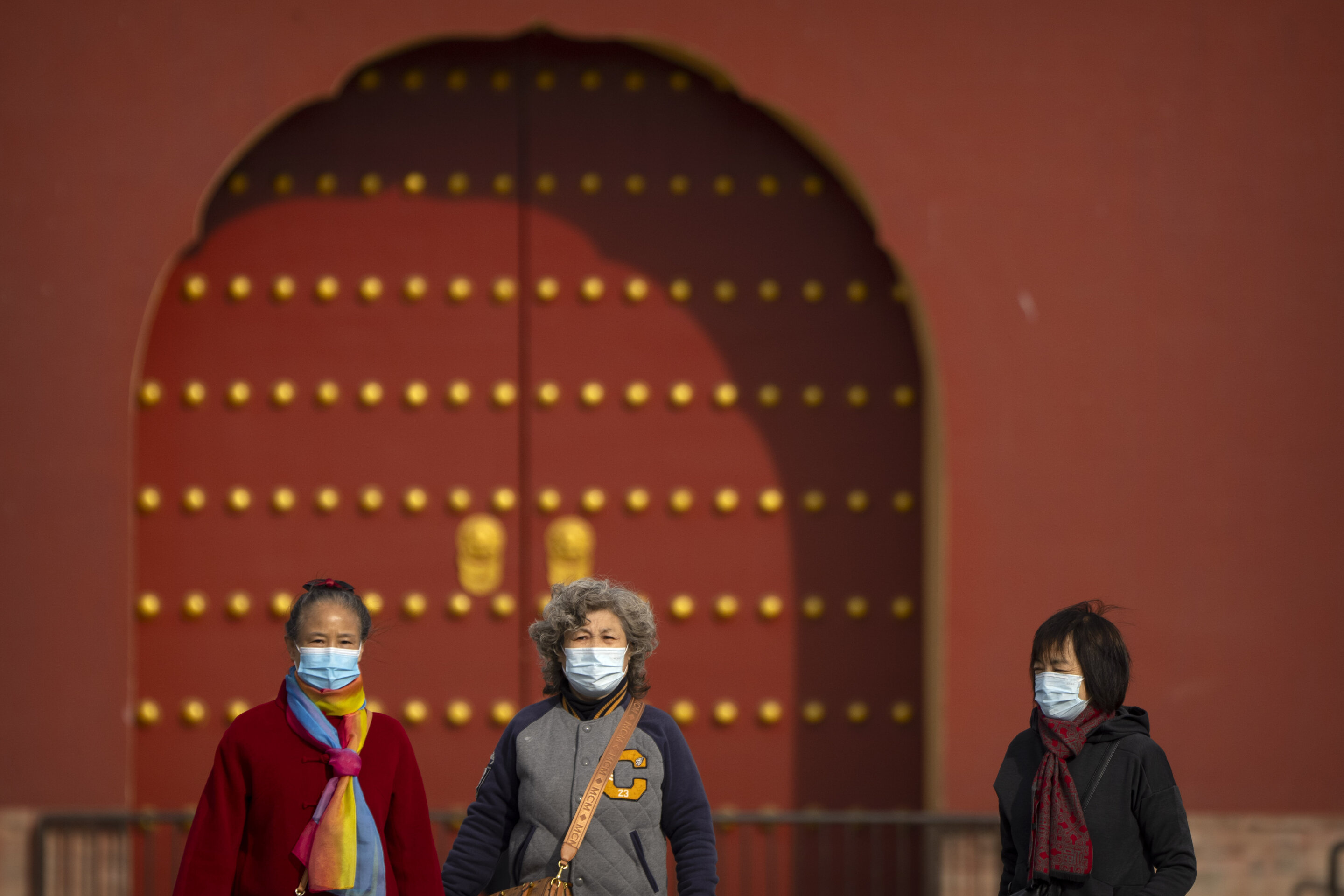 #China tightens restrictions as rise in virus cases reported