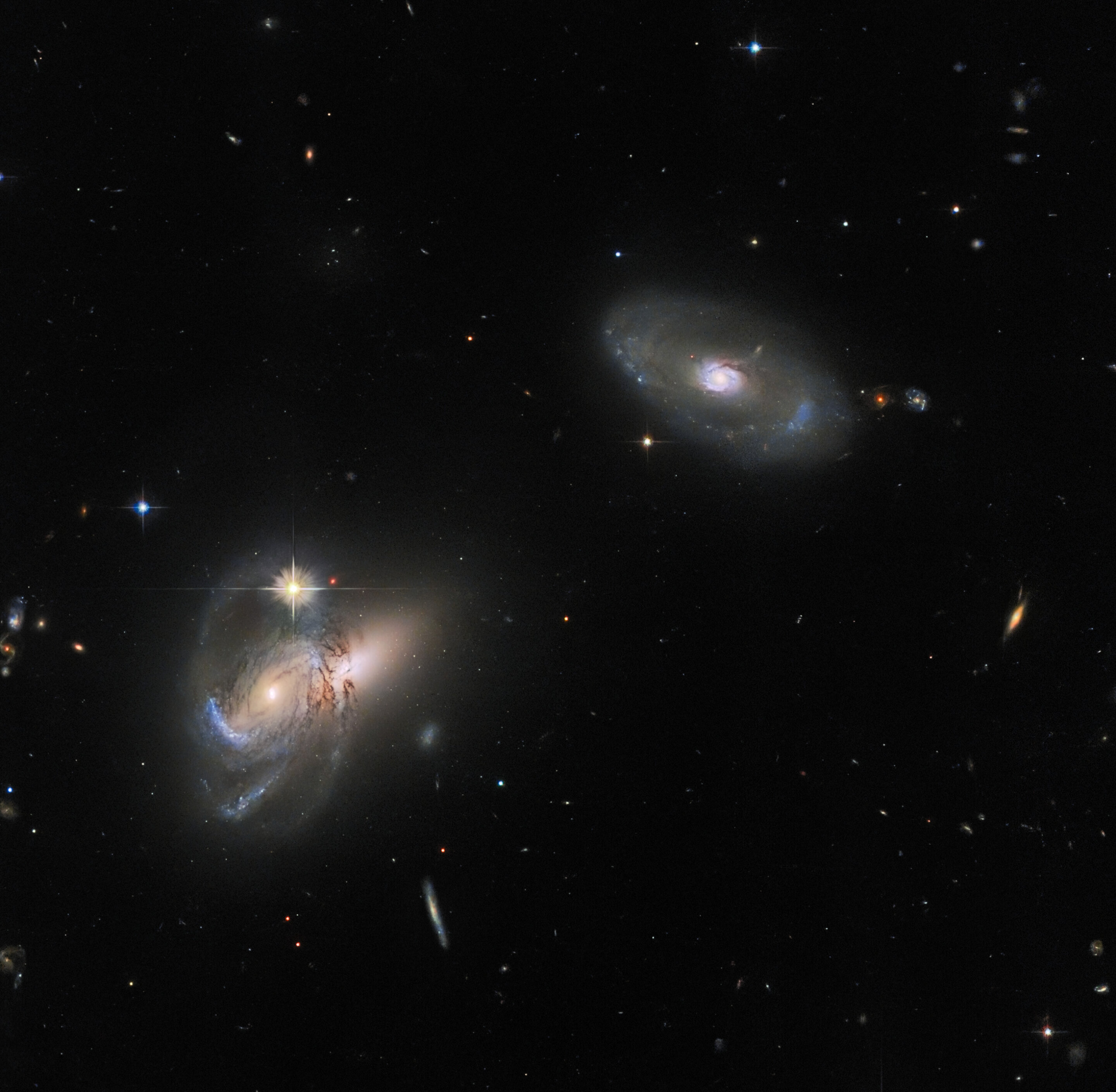 #Hubble images a complex galactic trio