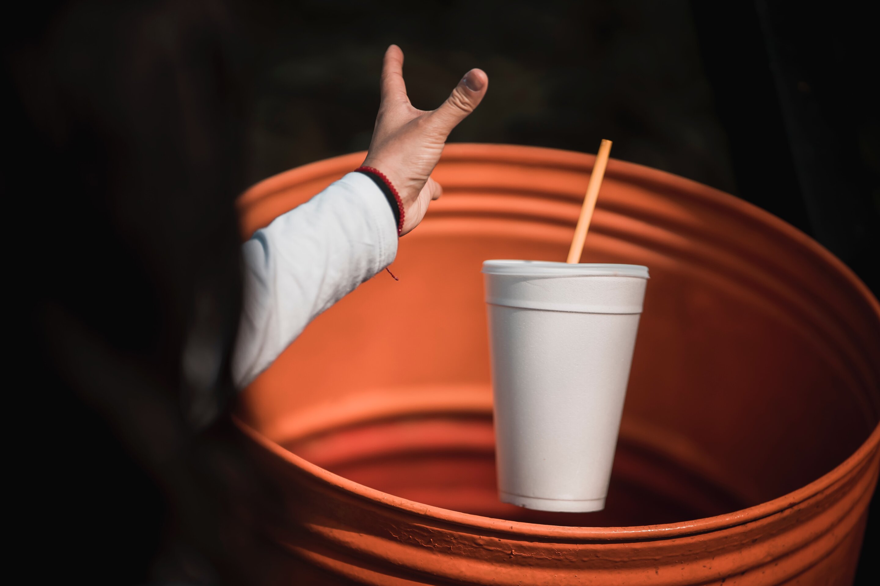 Environmental unfriendly disposed styrofoam plates and cups in garbage bags  Stock Photo