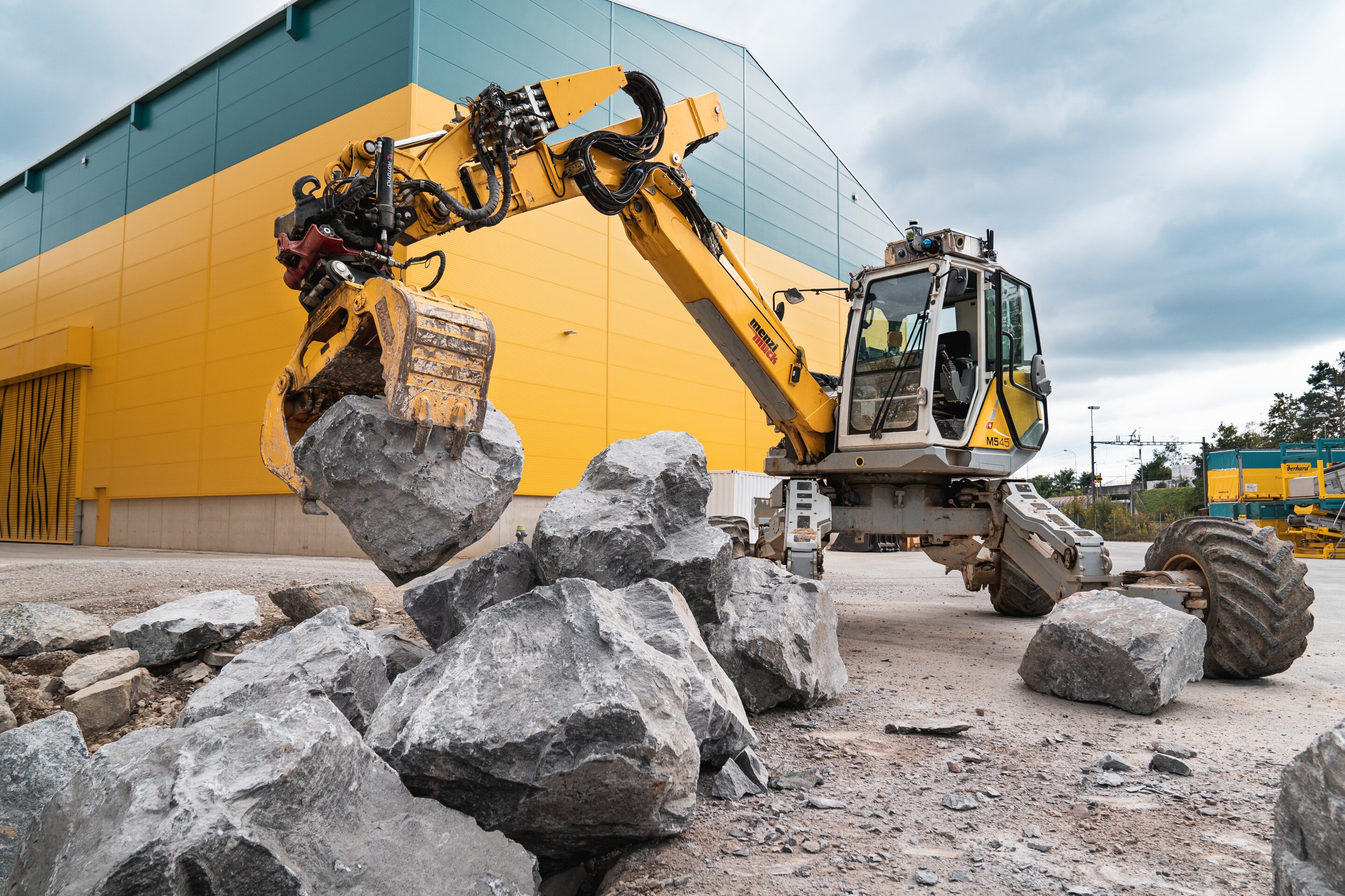 Autonomous excavator constructs a 6-meter-high dry-stone wall