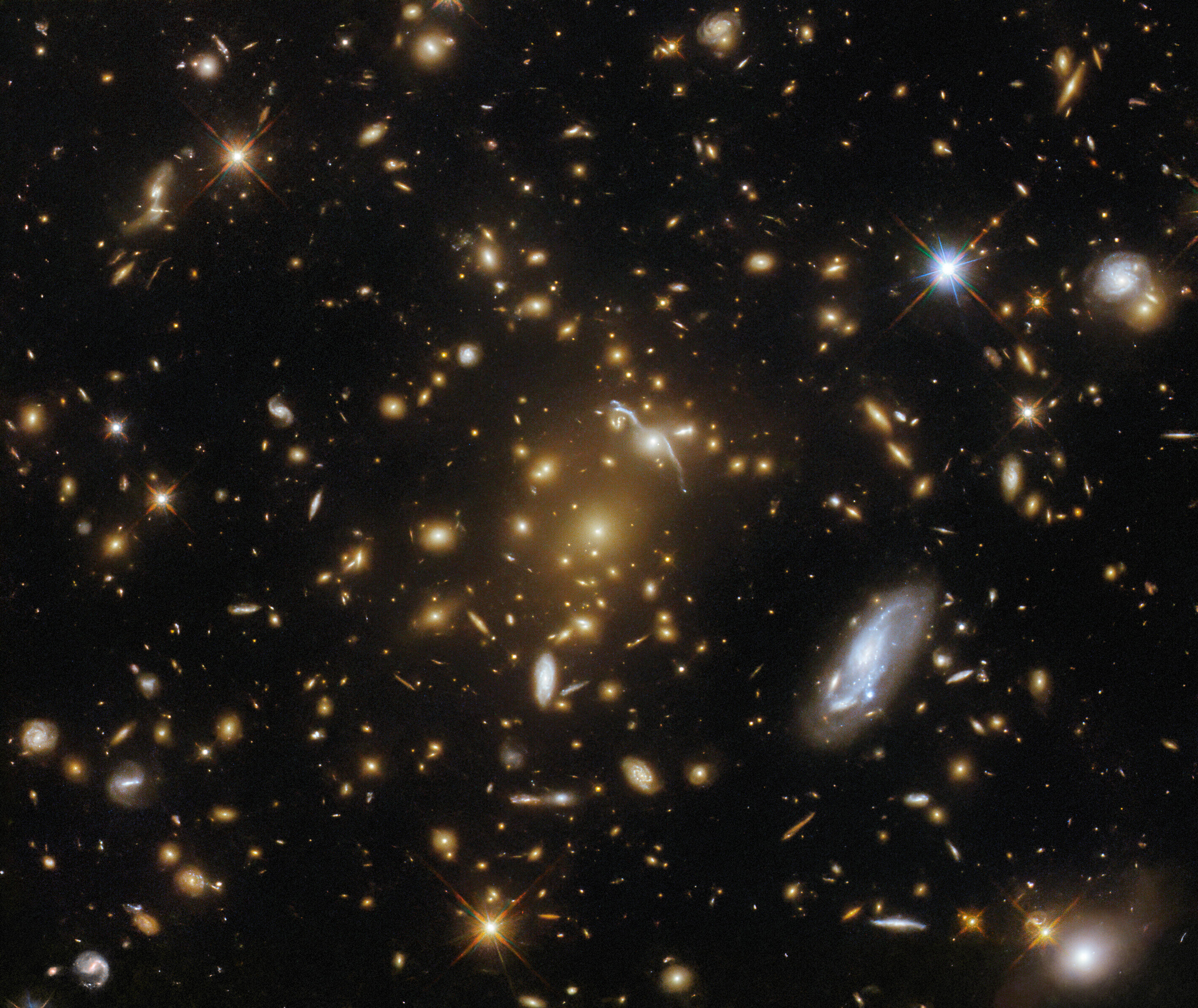 Hubble captures light-bending galaxy cluster eMACS J1823.1+7822