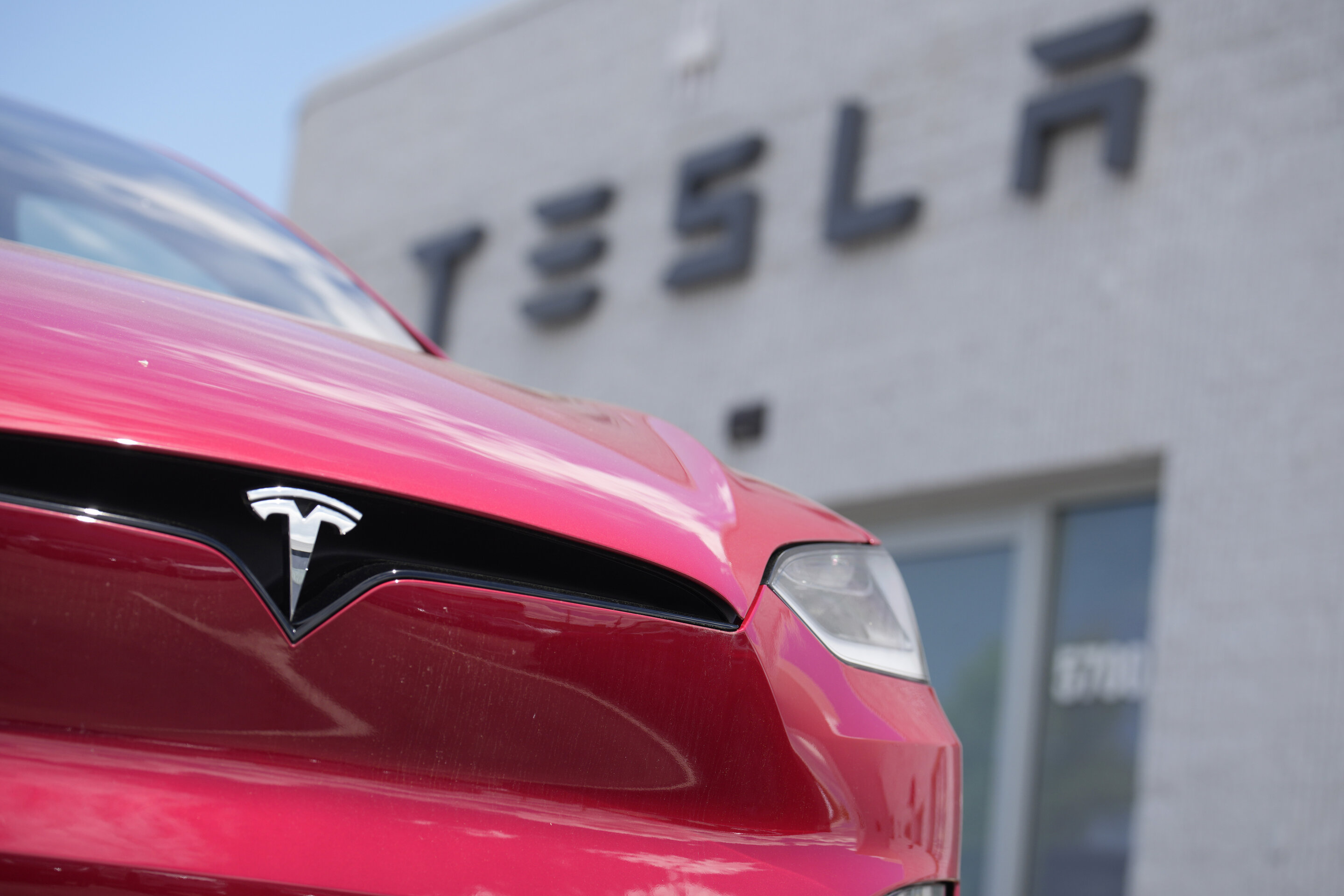 Tesla's stock leaps on reports of Chinese approval for the company's driving software